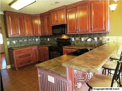 Kitchen with lots of cabinets.