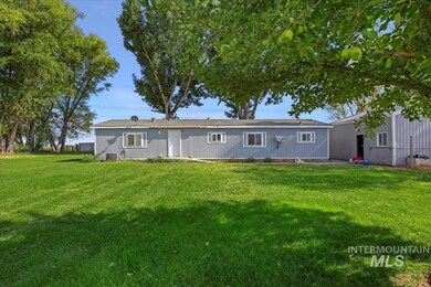 Rear view of property featuring a yard