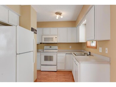 You'll love your bright and white kitchen!