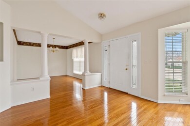 Additional view of entry and dining room.  Hardwoo