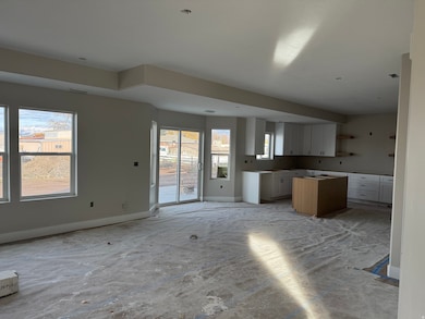 Kitchen with baseboards and white cabinets