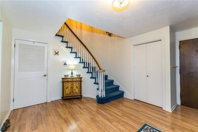 Large foyer with dramatic spiral stair case to 2nd