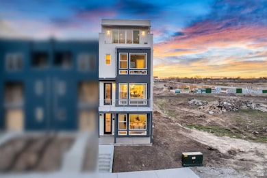 Back of house at dusk with stucco siding