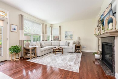 Family room with wall of windows, gas fireplace an