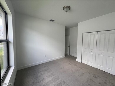 Unfurnished bedroom featuring a closet and carpet