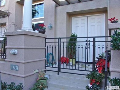 Stately entry  terrace and double doors.