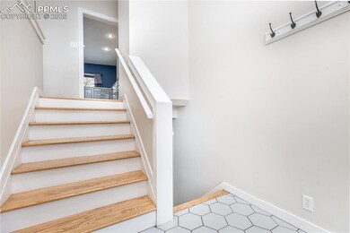 Stairs featuring tile patterned floors
