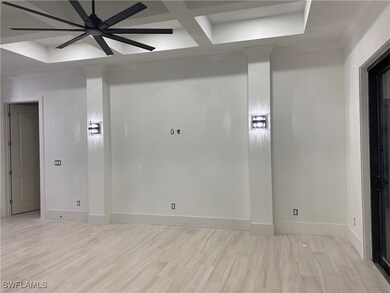 Empty room with baseboards, light wood-style floor