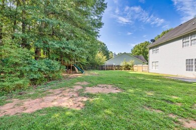 The backyard is massive and fully privacy-fenced in.
