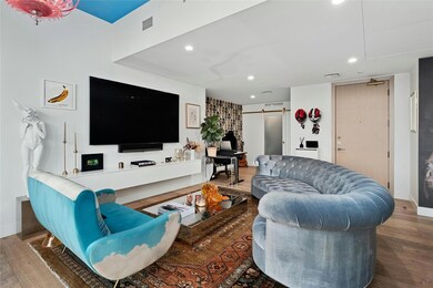 Living area featuring recessed lighting, a barn d