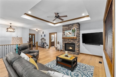 The fireplace casts a warm, golden glow when lit c