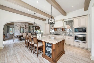 Kitchen looking to the dining area, two-way firepl