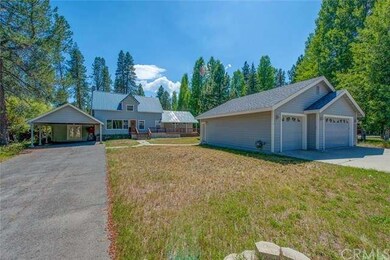 Spacious 2 car garage and carport. 