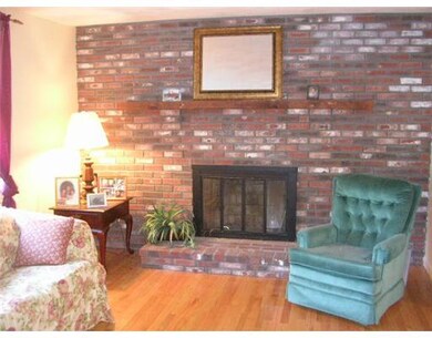 Living Room. Living room with brick raised hearth