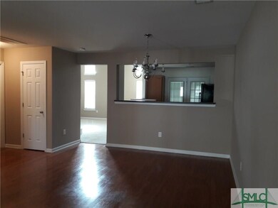dining area with breakfast bar & opening into kitc