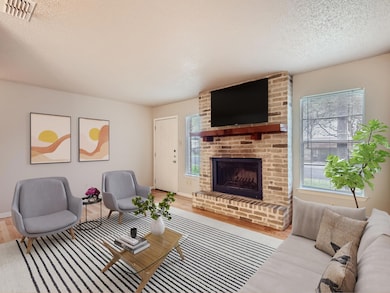 Living area with a textured ceiling, plenty of na