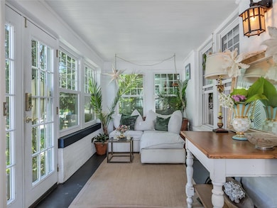 Call it casual elegance or shabby-chic , this light and bright sun room makes a great place to read, savor your favor libation or take an afternoon nap.