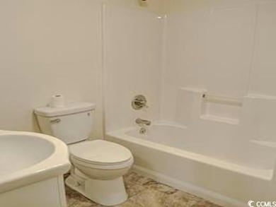 Full bath with shower / tub combination, toilet, and vanity
