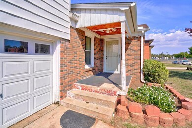 Doorway to property with a garage