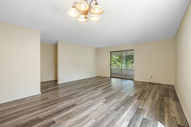 Large living room wit access to screened porch and golf course