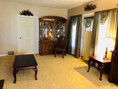 Enter from the sun porch to the large LR space!