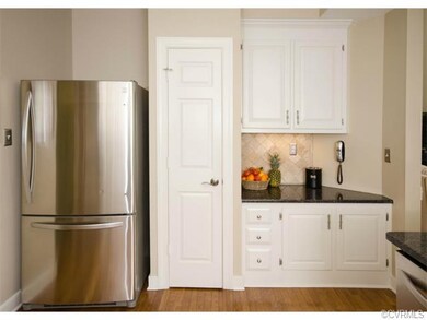 The kitchen was reconfigured to recess the refrige