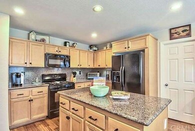 Granite Counters, Ample Cabinets and Center Island