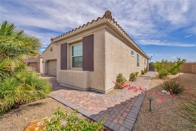 View of side of home featuring an attached garage,