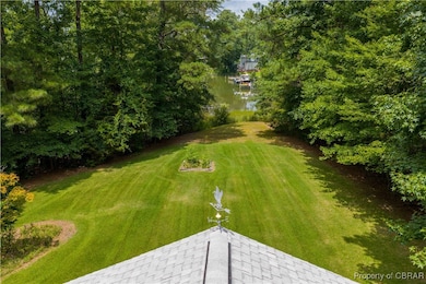 Bird's eye view of cove surrounded by dense forest.