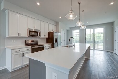 Open to living space, dining area and balcony