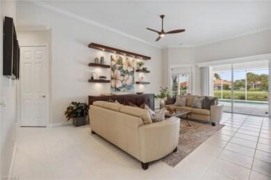 Living room with ceiling fan, light tile patterned