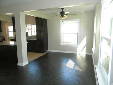 Espresso Laminate Flooring through out Dining room
