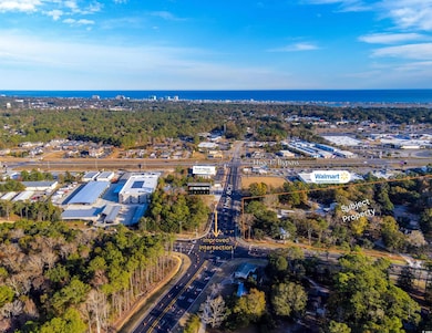 Birds eye view of property with a water view