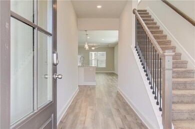 Entryway featuring light wood-style floors, recessed lighting, and stairway