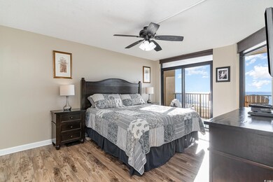 Bedroom featuring hardwood / wood-style floors, a 