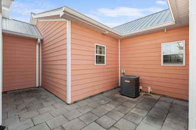 View of patio featuring central air condition unit