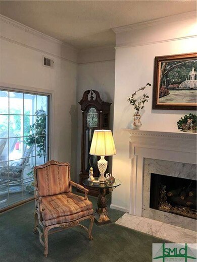 Sliding doors in the formal living room lead to a 