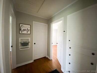 Hall leading to bedrooms and bath with original bu