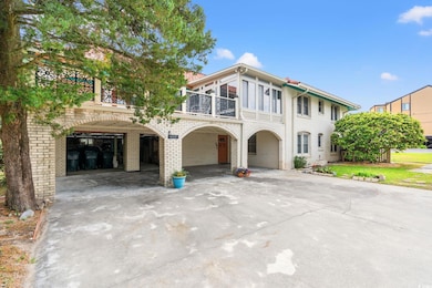 View of South side of house with a balcony, brick 