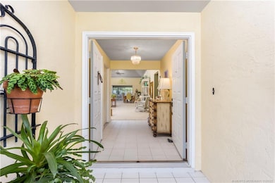 A covered entryway and double doors greet you.