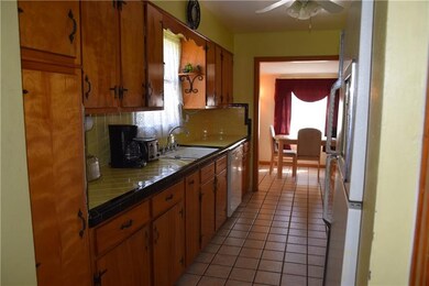 Charming galley kitchen for easy meal preparation.