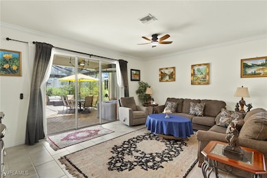 Living area featuring ornamental molding, ceiling
