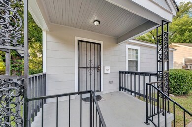 Property entrance with covered porch