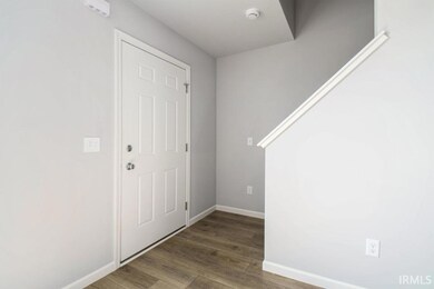 Enter into the foyer which opens to a spacious gre