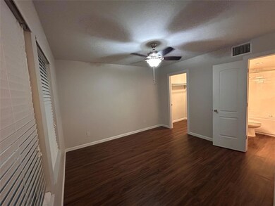 Unfurnished bedroom featuring dark wood finished 