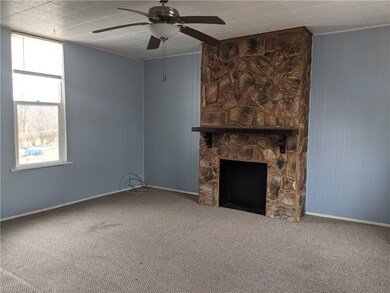 Living room   stone front unopened fireplace with