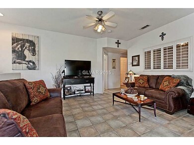 Living Room. Ceiling Fan to Keep those Air Conditi