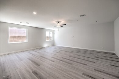 Unfurnished room featuring ceiling fan, light wood-style floors, and recessed lighting