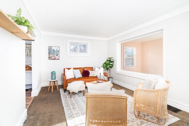 Sitting room featuring carpet floors