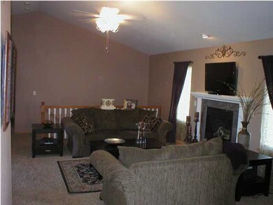 Main level living room with gas fireplace.